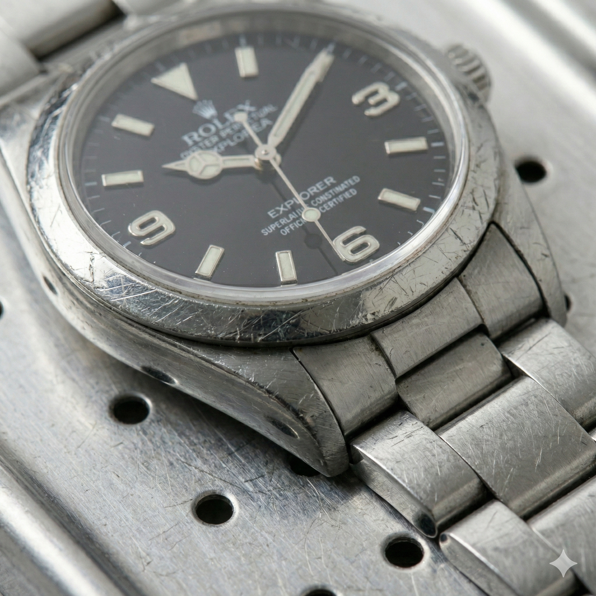 Before restoration - damaged luxury Rolex watch with visible wear and scratches requiring professional restoration